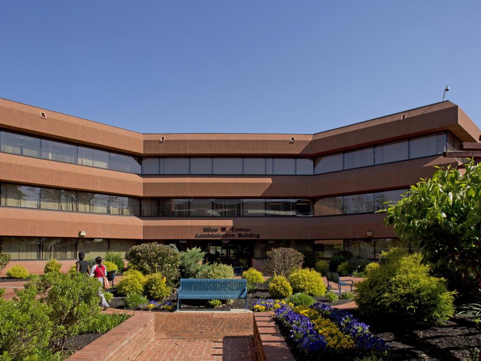 Front of the Miles W. Connor Administration building on a sunny day on the Coppin State University campus